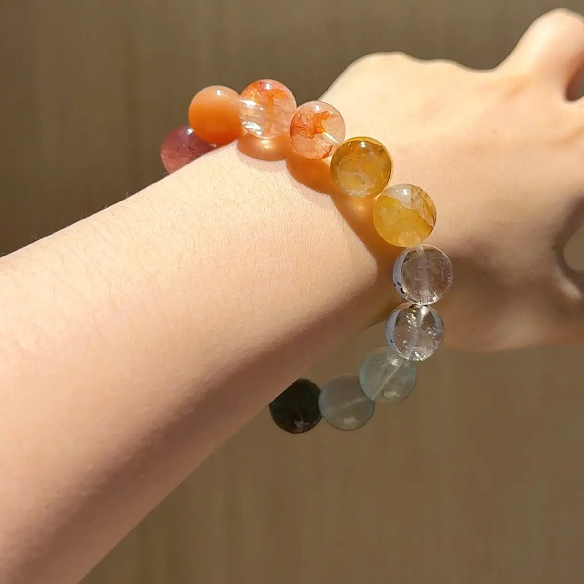 Handcrafted yellow-hematoid-quartz; red-hematoid-quartz; sunstone; strawberry-quartz; yellow-fluorite; green-rutilated-quartz; white-phantom-quartz Detail for Abundance - Astara