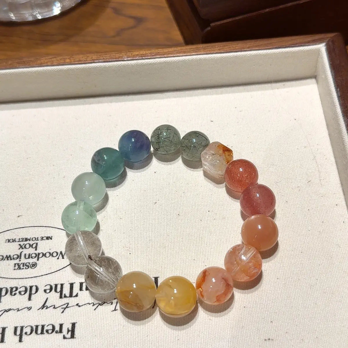 Handcrafted yellow-hematoid-quartz; red-hematoid-quartz; sunstone; strawberry-quartz; yellow-fluorite; green-rutilated-quartz; white-phantom-quartz Detail for Abundance - Astara