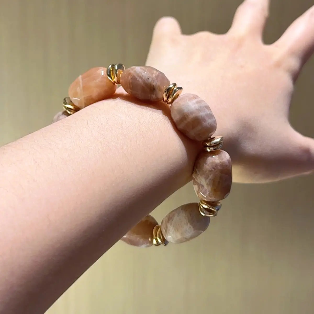 Sunstone freeform bracelet with golden orange sparkle for motivation confidence and wealth energy