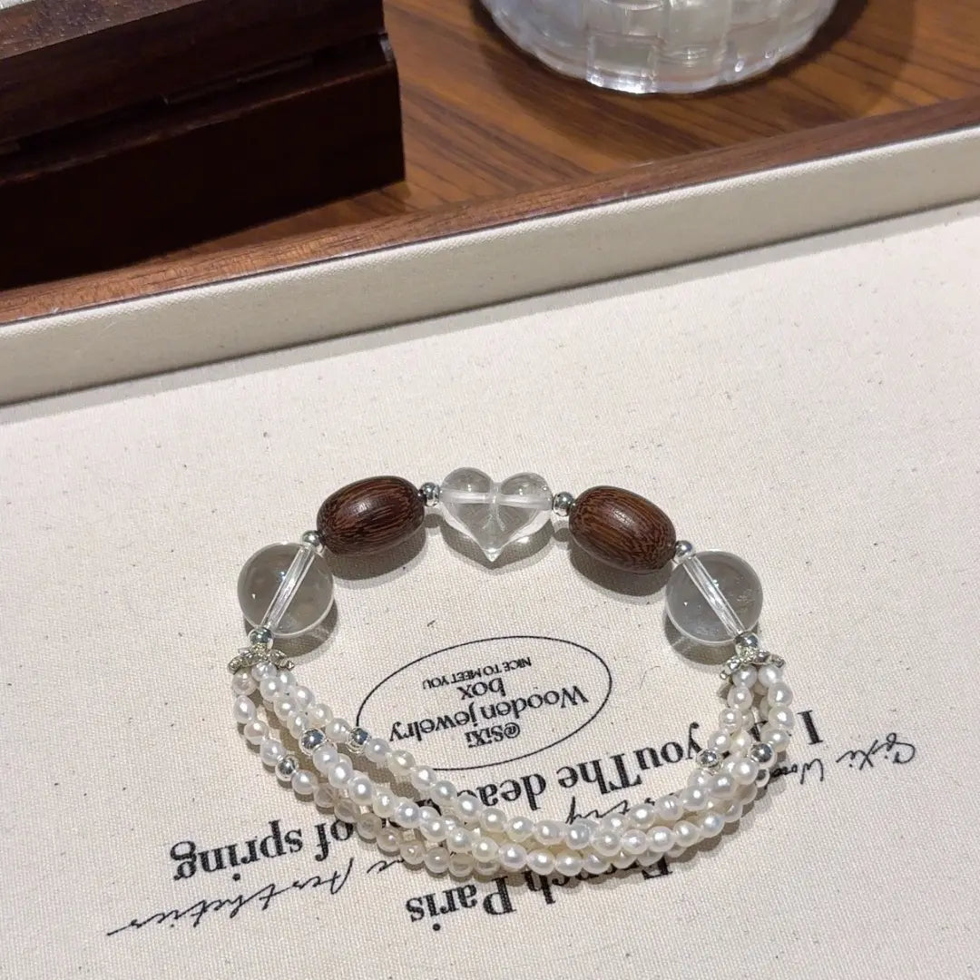 Clear quartz sandalwood and pearl bracelet for emotional healing balance and calm energy